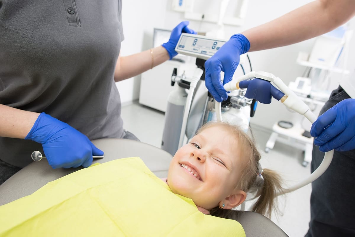 A kid enjoying the dentist